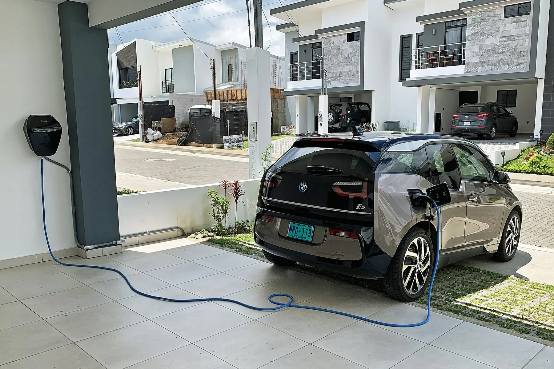 An electric car charging at home