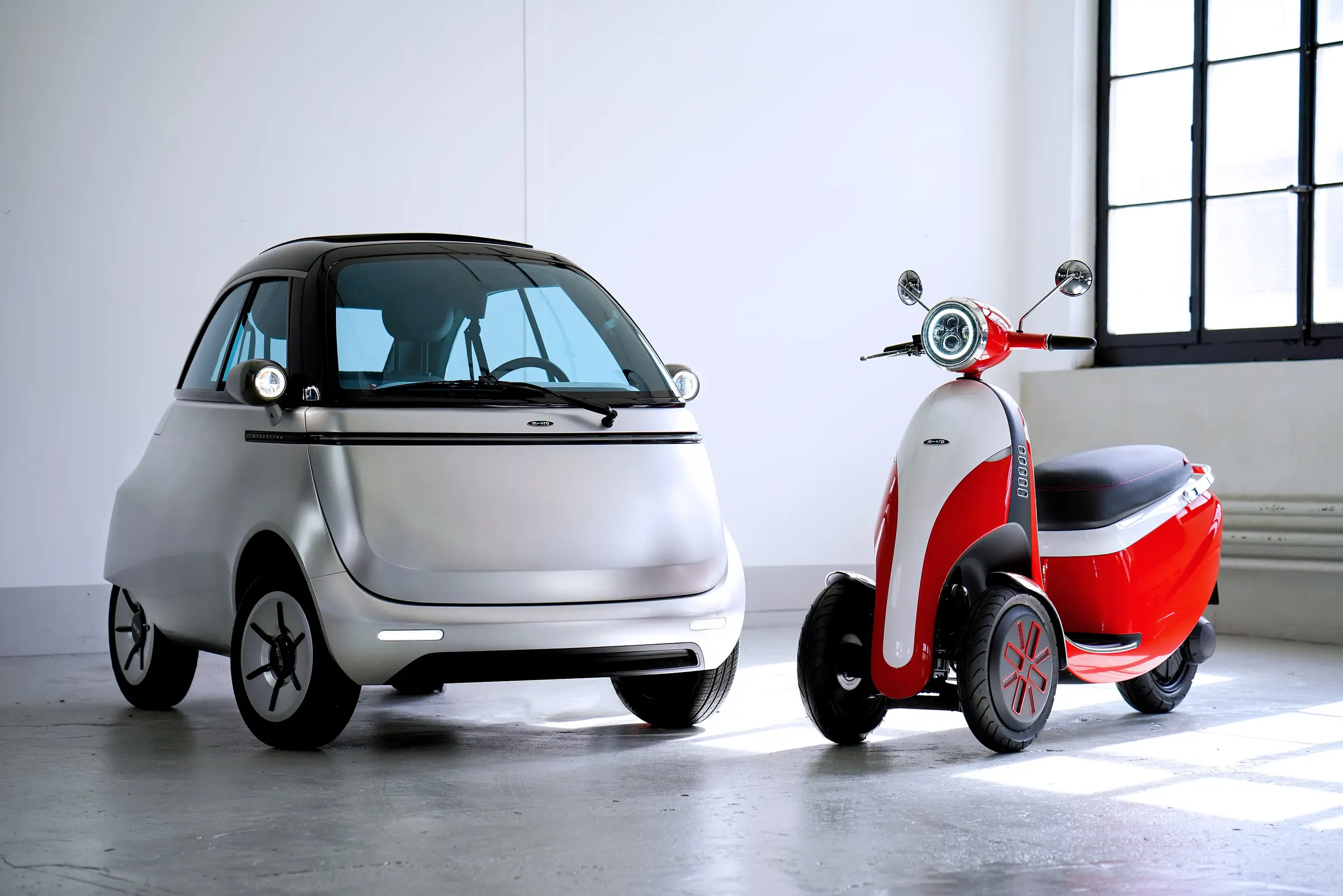 A compact electric car in a bright studio